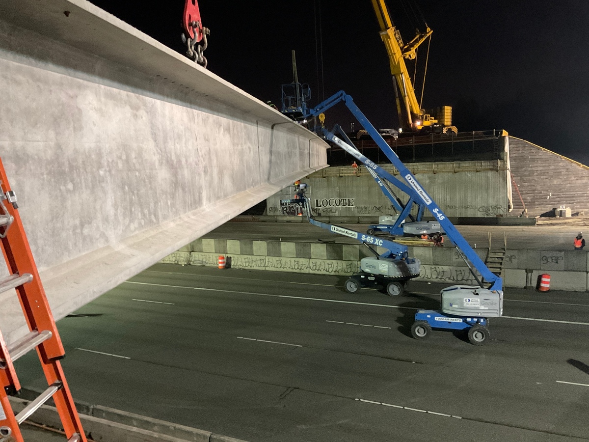One of the 15 concrete girders for a bridge over Interstate 5 in Fife is placed on Oct. 6, 2024. It’s part of the State Route 167 Completion Project.