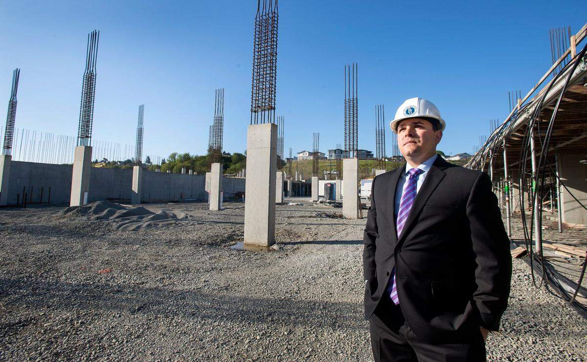 In this 2015 file photo, Loren Cohen inspects construction of the parking garage located at Point Ruston.