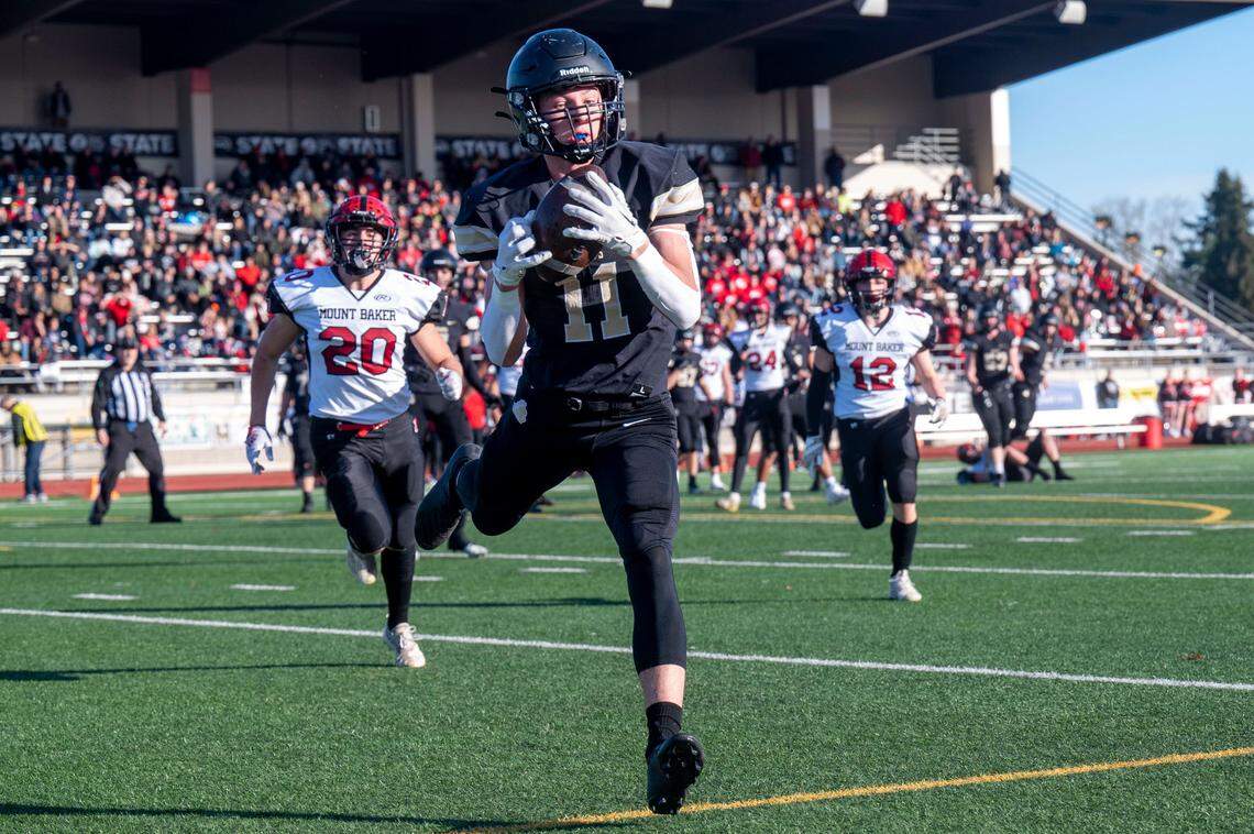 Royal receiver Lance Allred catches a touchdown pass from quarterback Dylan Allred during the second quarter of the Class 1A state championship game against Mount Baker on Saturday, Dec. 3, 2022, at Harry E. Lang Stadium in Lakewood, Wash.