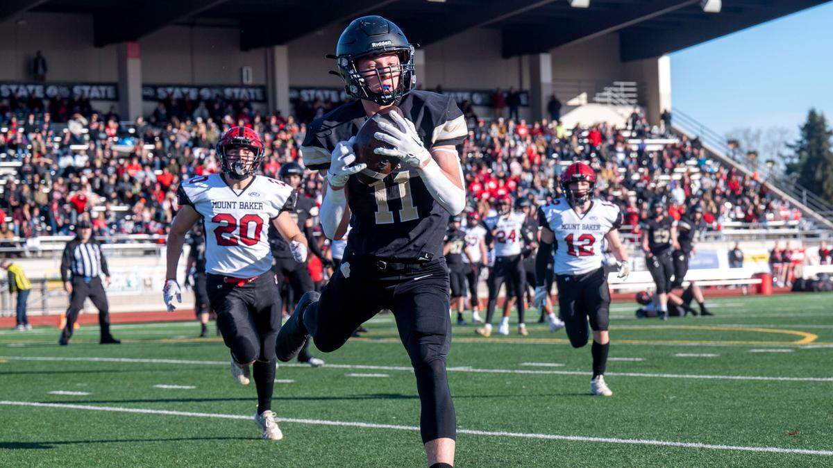 Royal receiver Lance Allred catches a touchdown pass from quarterback Dylan Allred during the second quarter of the Class 1A state championship game against Mount Baker on Saturday, Dec. 3, 2022, at Harry E. Lang Stadium in Lakewood, Wash.