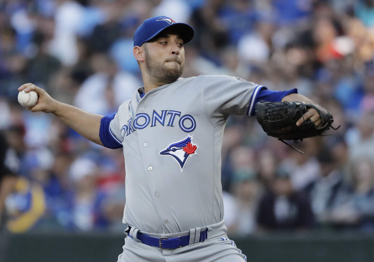 Toronto Blue Jays starting pitcher Marco Estrada throws to a Seattle Mariners batter during the first inning of a baseball game Saturday, Aug. 4, 2018, in Seattle. (AP Photo/Ted S. Warren)
