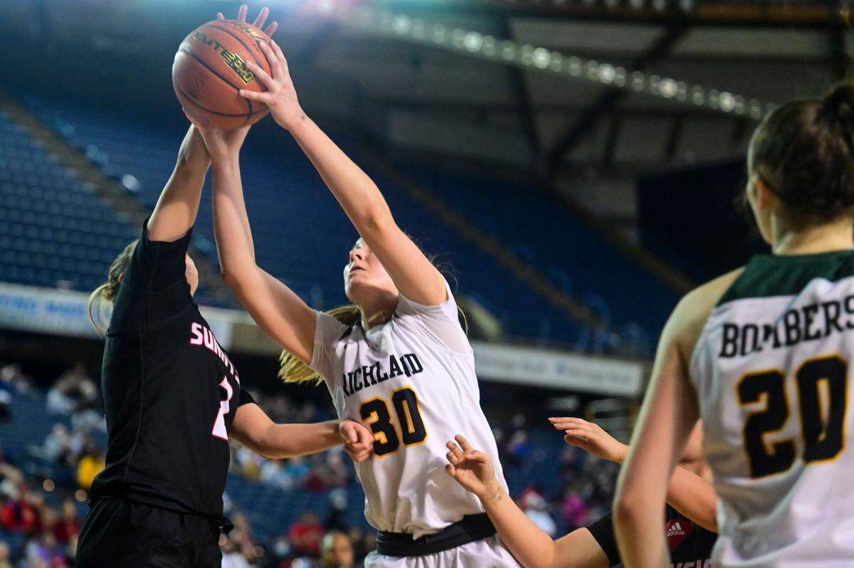 Richland guard Kylee Fox (30) fights for a rebound with Sunnyside guard Benemi Sanchez (2) during the fourth quarter of a Class 4A state tournament game on Wednesday, March 2, 2022, at the Tacoma Dome, in Tacoma, Wash.