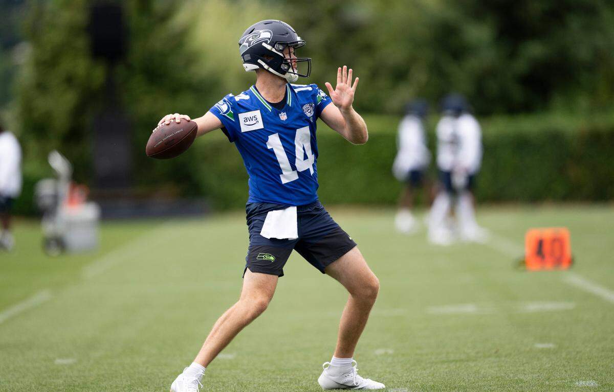 Seattle Seahawks quarterback Sam Darnold (14) throws the ball during training camp at Virginia Mason Athletic Center on Friday, July 25, 2025, in Renton.