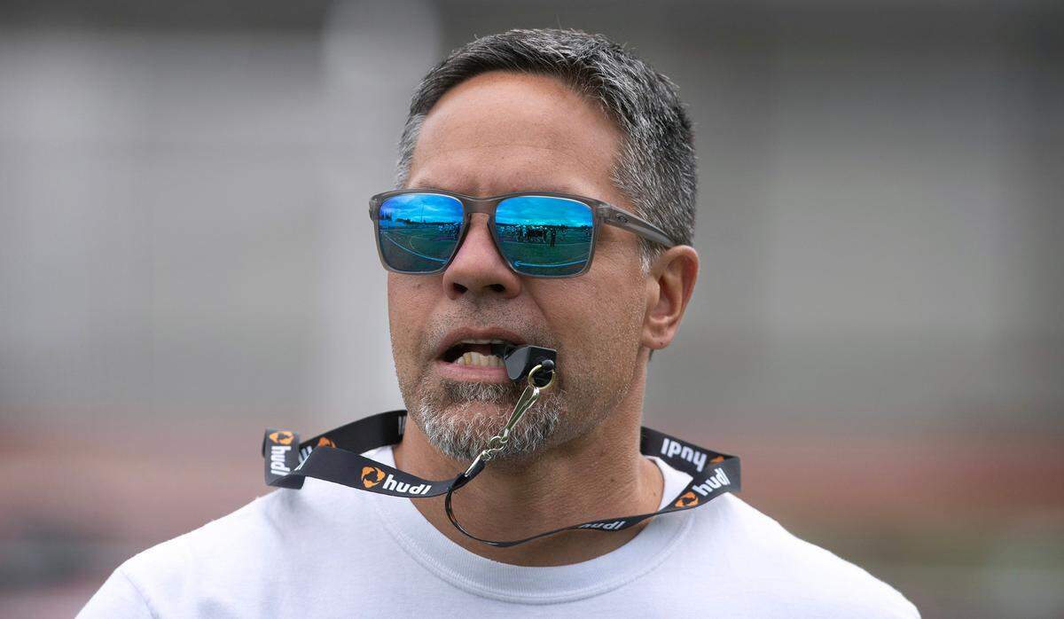 Yelm head coach Jason Ronquillo directs the Tornados during the opening day of football practice at Yelm High School in Yelm, Washington, on Wednesday, Aug. 21, 2024.