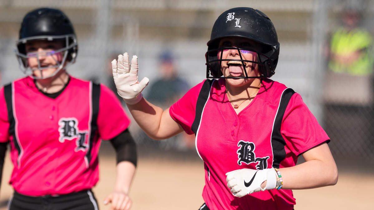 Bonney Lake outfielder Morgan Berg reacts to scoring a run against Lincoln during the softball game at Bonney Lake High School, on Thursday, April 18, 2024, in Bonney Lake, Wash.