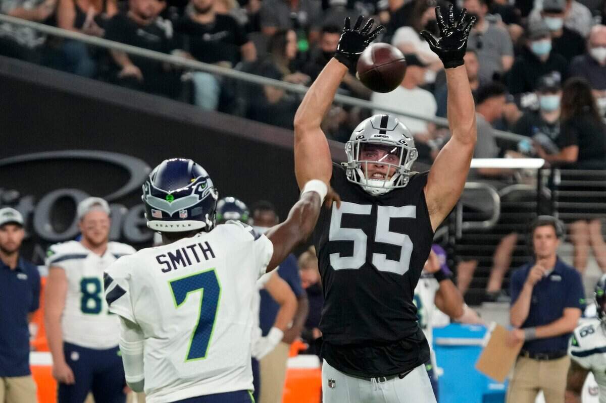 Las Vegas Raiders linebacker Tanner Muse (55) knocks down a pass thrown by Seattle Seahawks quarterback Geno Smith (7) during the first half of an NFL preseason football game, Saturday, Aug. 14, 2021, in Las Vegas. (AP Photo/Rick Scuteri)