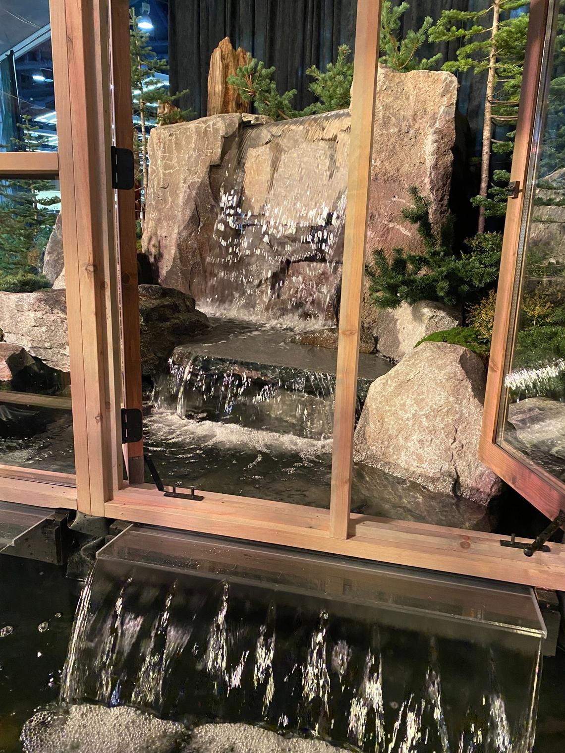 A waterfall delivers water into a greenhouse in “Fallingwater Greenhouse” at the Northwest Flower & Garden Show. It was designed by Tumwater’s Landon Moore.