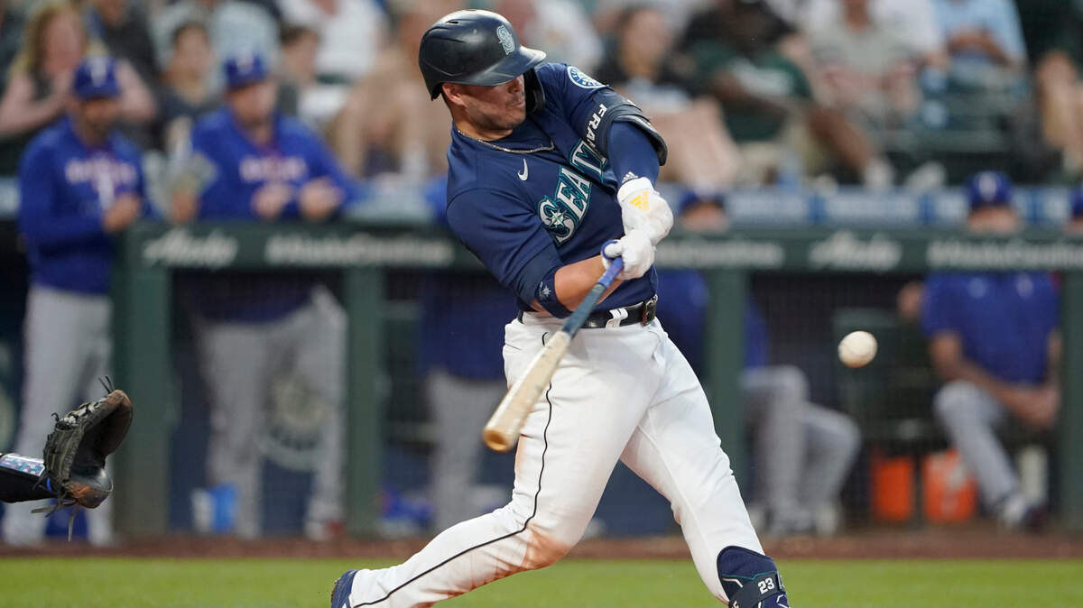 Seattle Mariners’ Ty France hits a solo home run against the Texas Rangers during the fifth inning of a baseball game, Monday, July 25, 2022, in Seattle. (AP Photo/Ted S. Warren)
