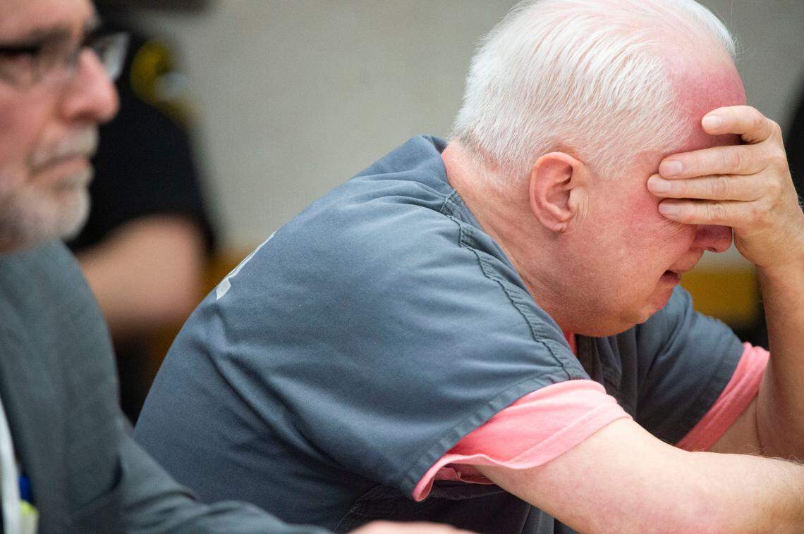 Gary Hartman (right), 70, cries as he apologizes to the family of Michella Welch during his statement to a Pierce County Superior Court at his bench trial and sentencing on Tuesday, March 22, 2022, in Tacoma, Wash. Hartman was found guilty by Judge Stanley Rumbaugh and sentenced to 26 years, six months for the 1986 rape and murder of 12-year-old Michella Welch in Tacoma.