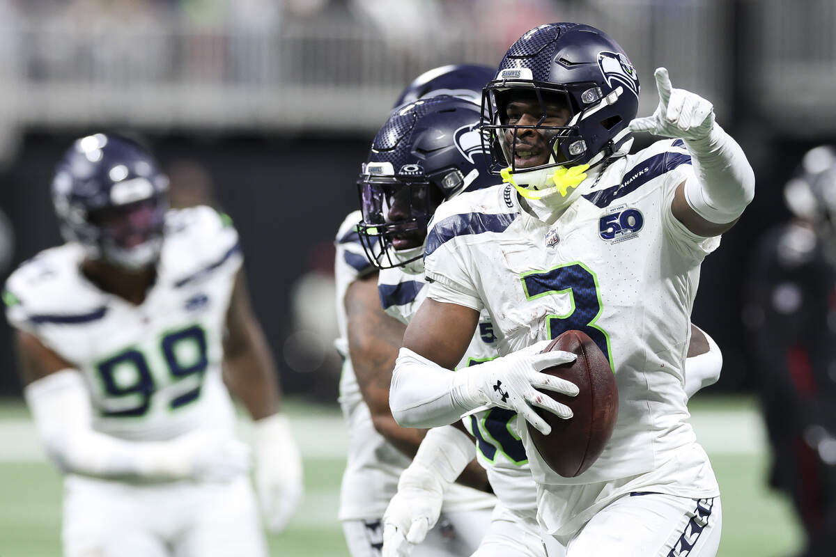 Nick Emmanwori (3) of the Seattle Seahawks reacts after a interception during the third quarter against the Atlanta Falcons at Mercedes-Benz Stadium on Dec. 7, 2025 in Atlanta.