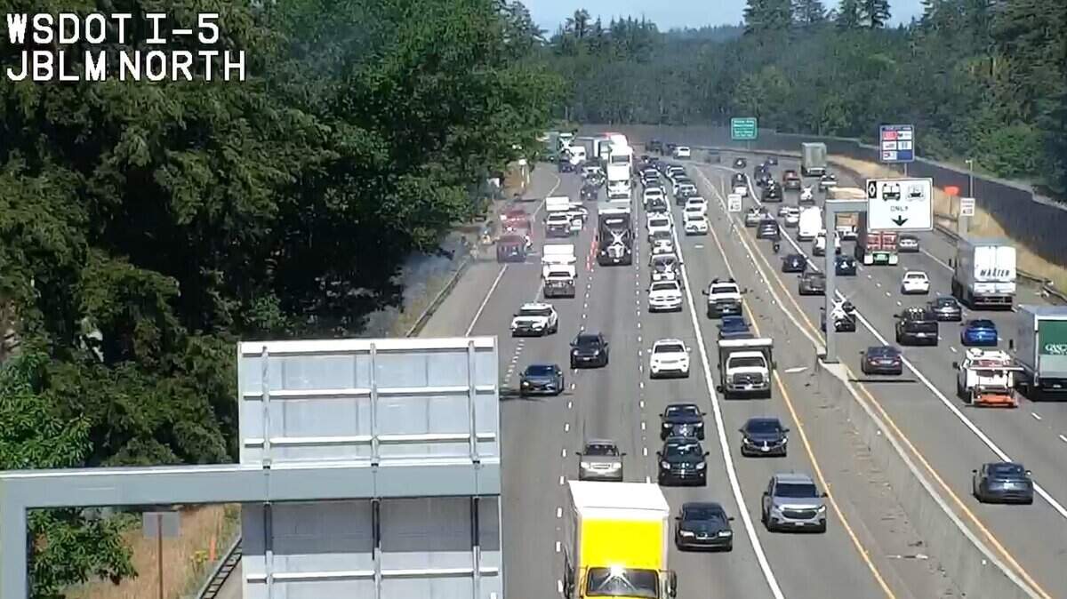 The right two lanes of southbound Interstate 5 are closed Monday as crews battle a brush fire at Joint Base Lewis-McChord.