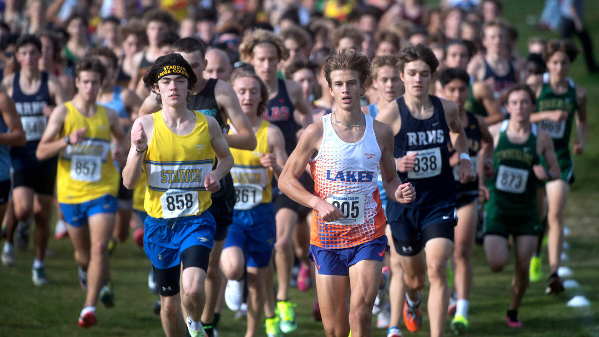 3A boys winner Cruize Corvin of Lakes takes the early lead during the Westside Classic district cross country championships at Chambers Bay Golf Course in University Place, Washington, on Saturday, Oct. 29, 2022.