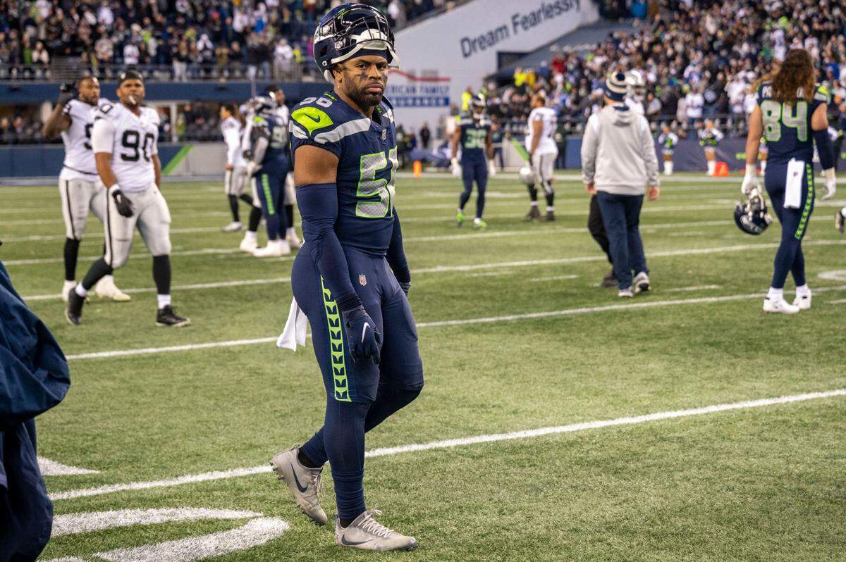 Seattle Seahawks linebacker Jordyn Brooks (56) walks away from the sideline after Las Vegas Raiders running back Josh Jacobs (28) scored the game-winning touchdown in overtime of an NFL game on Sunday, Nov. 27, 2022, at Lumen Field in Seattle.