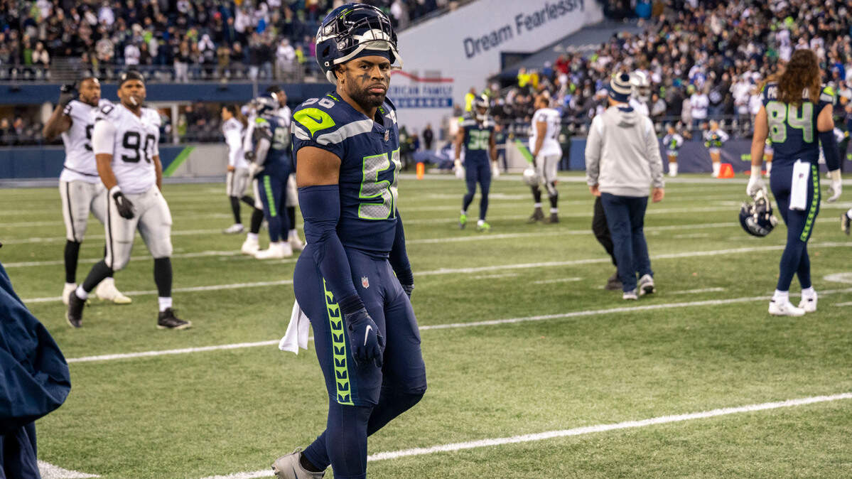 Seattle Seahawks linebacker Jordyn Brooks (56) walks away from the sideline after Las Vegas Raiders running back Josh Jacobs (28) scored the game-winning touchdown in overtime of an NFL game on Sunday, Nov. 27, 2022, at Lumen Field in Seattle.