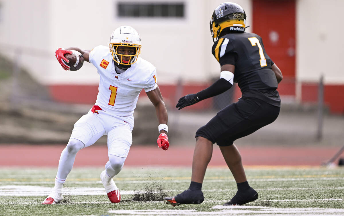 Mount Tahoma wide receiver Elijah Durr (1) picks up yards against Lincoln defensive back Elijah Carney (7) during the first half of the game at Lincoln High School, on Saturday, Oct. 4, 2025, in Tacoma, Wash.
