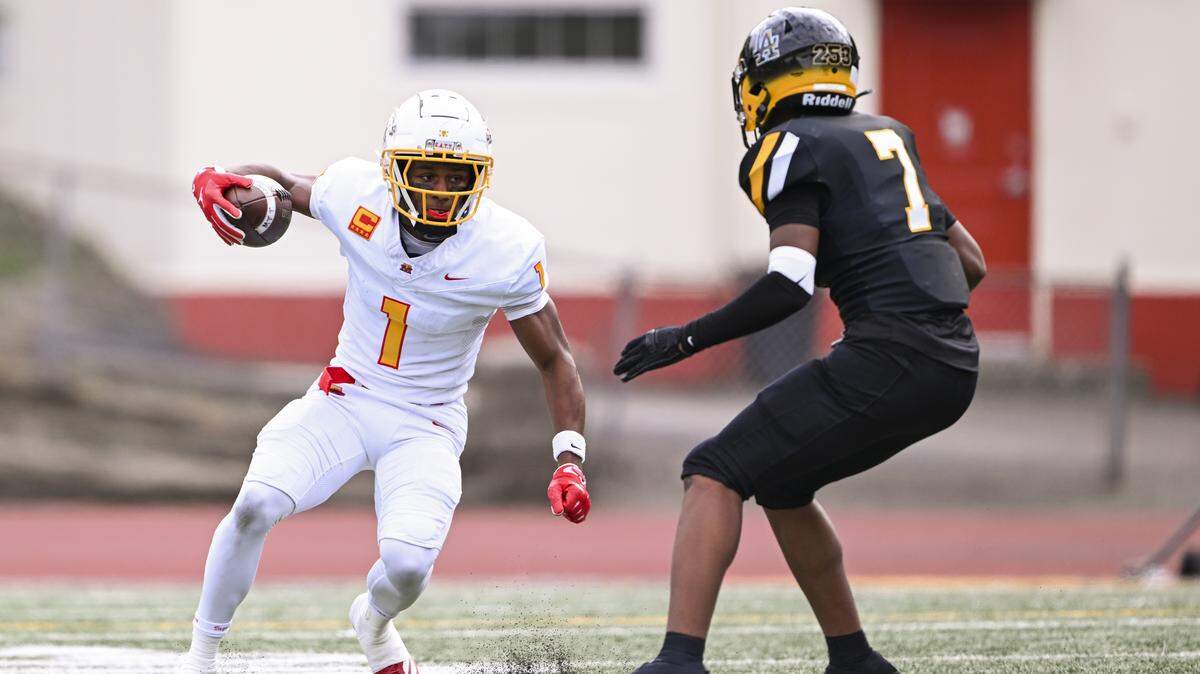Mount Tahoma wide receiver Elijah Durr (1) picks up yards against Lincoln defensive back Elijah Carney (7) during the first half of the game at Lincoln High School, on Saturday, Oct. 4, 2025, in Tacoma, Wash.