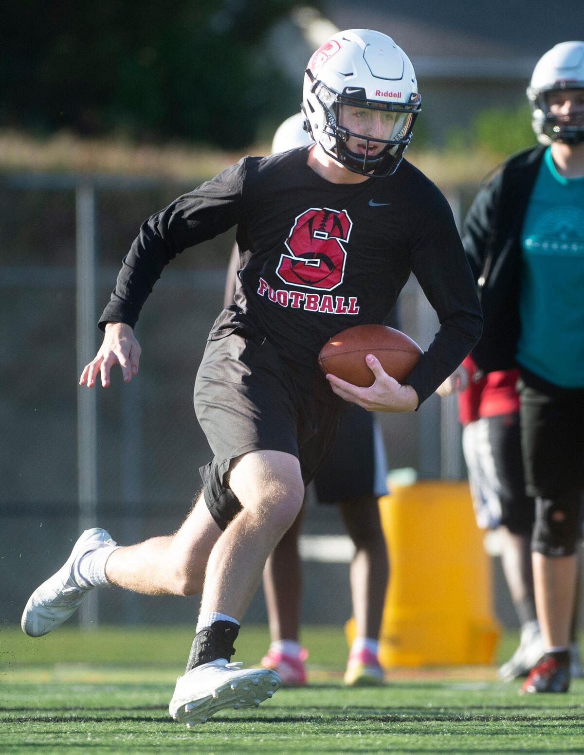 Steilacoom quarterback Chance McDonald runs through drills during football practice at Steilacoom High School on Wednesday, Oct. 30, 2019.