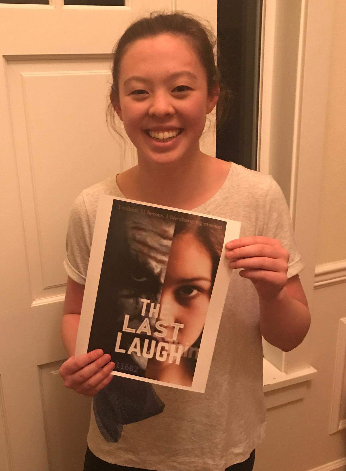 Ellie Hood shows off a rough draft of one of her book covers as a part of a project she worked on in Peninsula High School’s STEM Club.