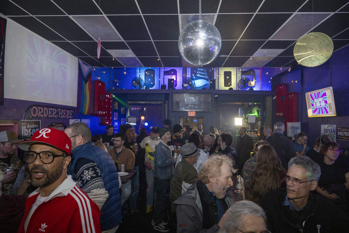A crowd gathers for an election night watch party at Hilltop A Go-Go on Tuesday, Nov. 4, 2025, in Tacoma, Wash.