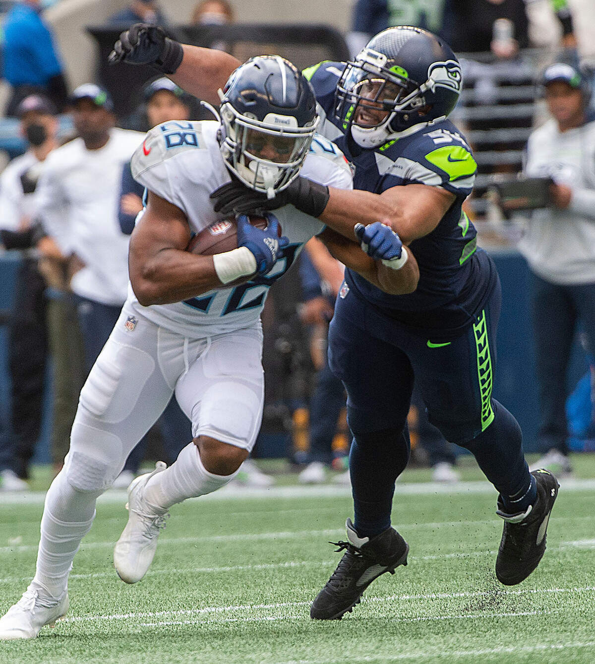 Seahawks linebacker Bobby Wagner tackles Titans running back Jeremy McNichols. The Seattle Seahawks played the Tennessee Titans in an NFL football game at Lumen Field in Seattle, Wash., on Sunday, Sept. 19, 2021.