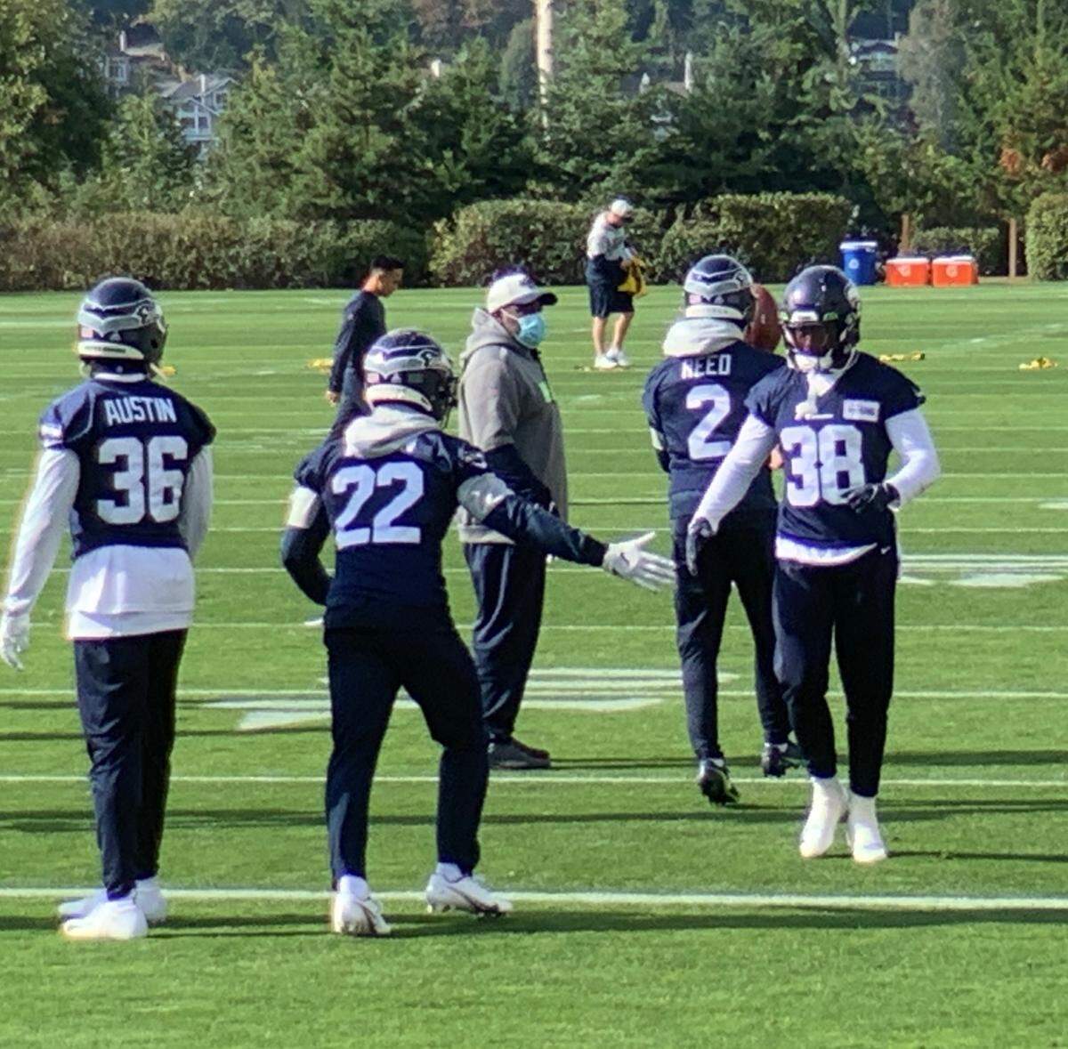 Rookie cornerback Tre Brown (22), off injured reserve, at Seahawks practice with cornerbacks Bless Austin (36) and Gavin Heslop (38) Wednesday, Oct. 13, 2021, at Seahawks headquarters in Renton.