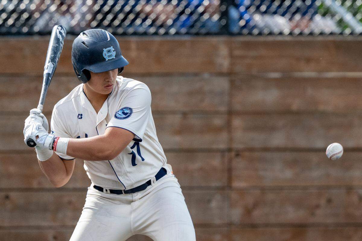 Gig Harbor’s Ethan Mar watches the ball as he prepares to swing on Saturday, May 17, 2025, during the 3A District Championship game against Peninsula in Auburn, Wash.