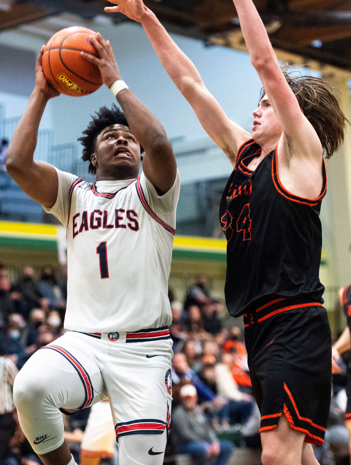 Life Christian’s guard Dai’Shaun Nichols (1) jumps to shoot the ball as Zillah’s forward Luke Navarre (34) defends during the high school boys 1A basketball state tournament regional round game at Foss High School in Tacoma, Wash. on Saturday, Feb. 26, 2022.