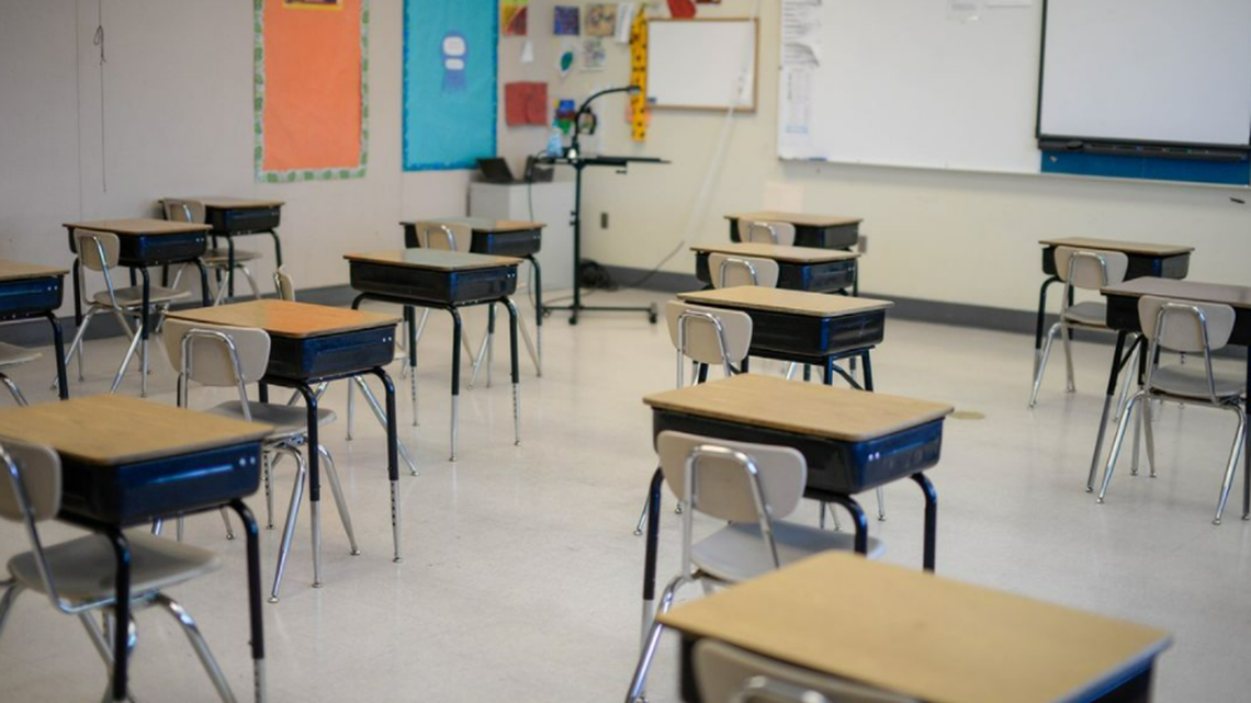 In this Dec. 31, 2020, photo, desks are separated to allow for physical distancing during the COVID-19 pandemic. Staff and students are mandated to wear face masks in school buildings, but one Oregon teacher refuses.