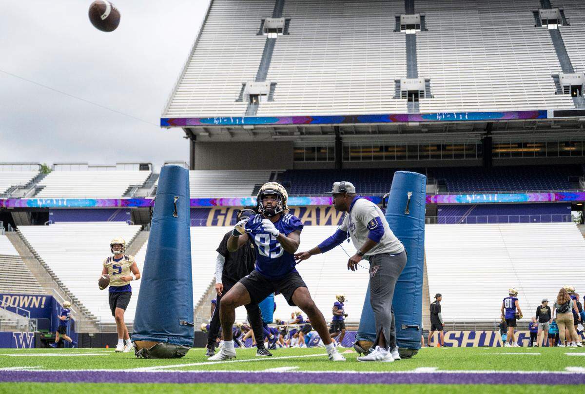 University of Washington Huskies tight end Devin Culp, 83, looks to catch the ball during a drill at the first day of Fall practice at Husky Stadium on Thursday, Aug. 4, 2022 in Seattle, Wash.