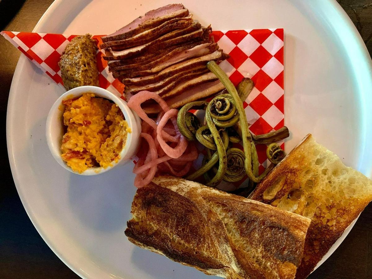 The tasso ham plate at Chicory in Olympia epitomizes the restaurant’s approach to local, seasonal cooking with PNW ingredients and Southern flair.