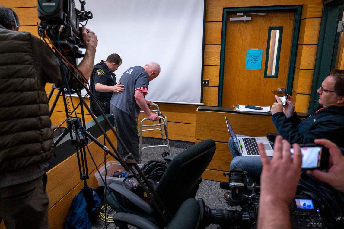 Gary Charles Hartman, 70, leaves the courtroom to meet with his defense attorney Bryan Hershman prior to the start of his trial for the 1986 rape and murder of Michella Welch in Pierce County Superior Court on Tuesday, March 22, 2022, in Tacoma, Wash.