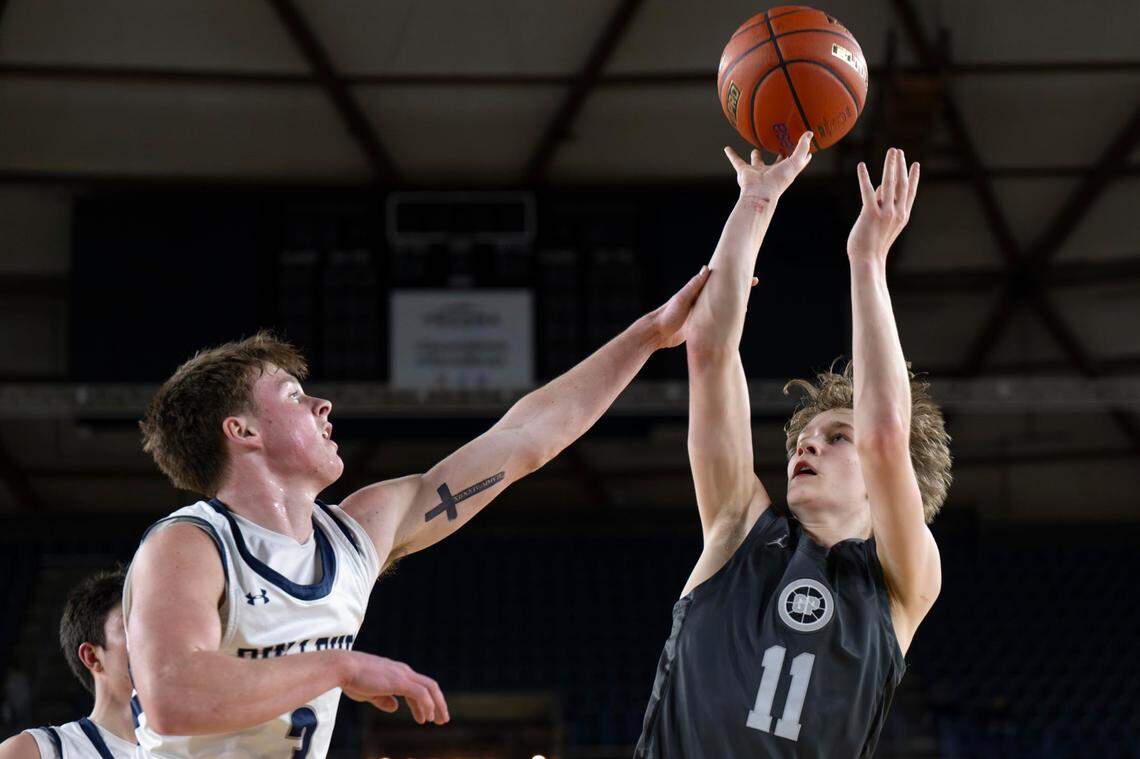 Glacier Peak guard Reed Nagel (11) attempts a shot as Gonzaga Prep guard Hudson Floyd (3) defends during the third quarter of a Class 4A state basketball tournament semifinal game at the Tacoma Dome on Friday, March 7, 2025, in Tacoma.