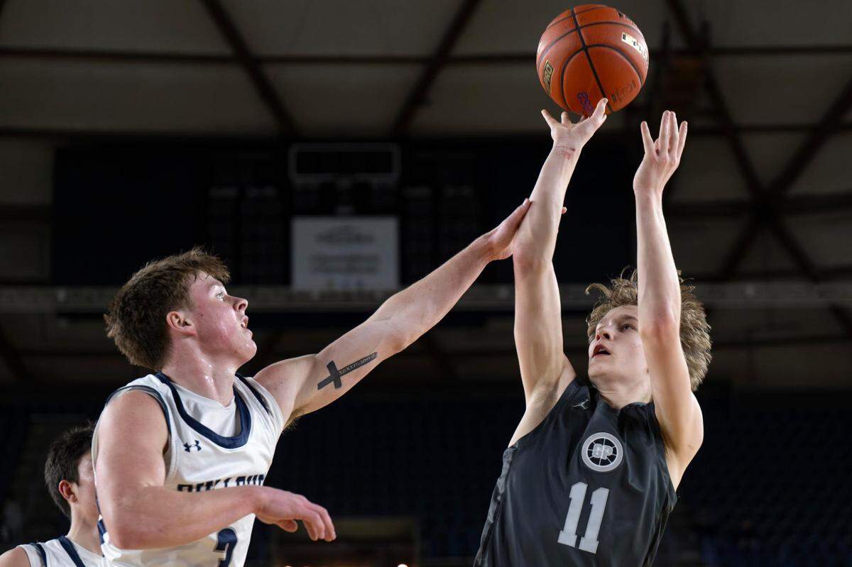 Glacier Peak guard Reed Nagel (11) attempts a shot as Gonzaga Prep guard Hudson Floyd (3) defends during the third quarter of a Class 4A state basketball tournament semifinal game at the Tacoma Dome on Friday, March 7, 2025, in Tacoma.