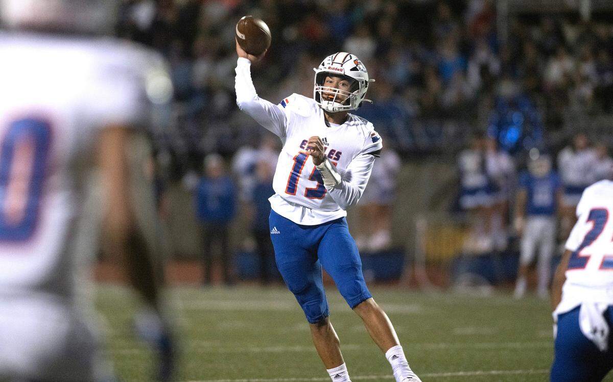 Graham Kapowsin quarterback Daveon Superales fires a pass during Friday night’s 4A SPSL football game against the Curtis Vikings at Viking Stadium in University Place, Washington, on Oct. 6, 2023. Graham Kapowsin won the game, 42-35.
