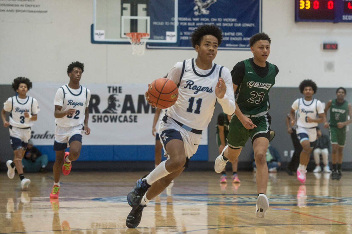 Rogers guard Treyshawn Weatherspoon (11) brings the ball up the court in a game against Franklin on Monday, Jan. 15, 2024 at Federal Way High School in Federal Way, Wash.