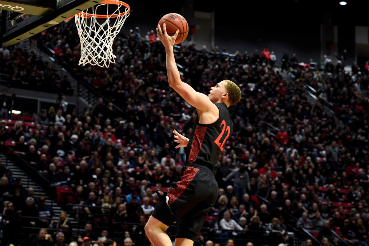 San Diego State guard Malachi Flynn (22) shoots during the second half of an NCAA college basketball game against UNLV Saturday, Feb. 22, 2020, in San Diego. UNLV won 66-63. (AP Photo/Denis Poroy)