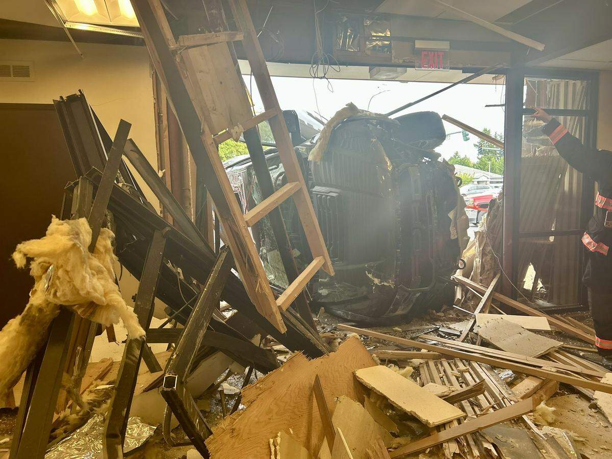 A vehicle that crashed into a Key Bank location when the driver suffered a medical emergency caused serious damage to the interior of the bank Friday, May 16, 2025, in Spanaway, Wash.