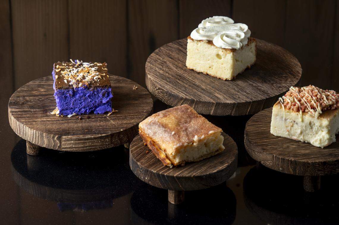 Treats from gluten-free bakery Little Miss Sweets NYC are pictured on Friday, Aug. 8, 2025, in Tacoma, Wash. From left: Ube cheesecake, Churro New York cheesecake, Caribbean-style Tres Leches and Strawberry Crunch cheesecake.