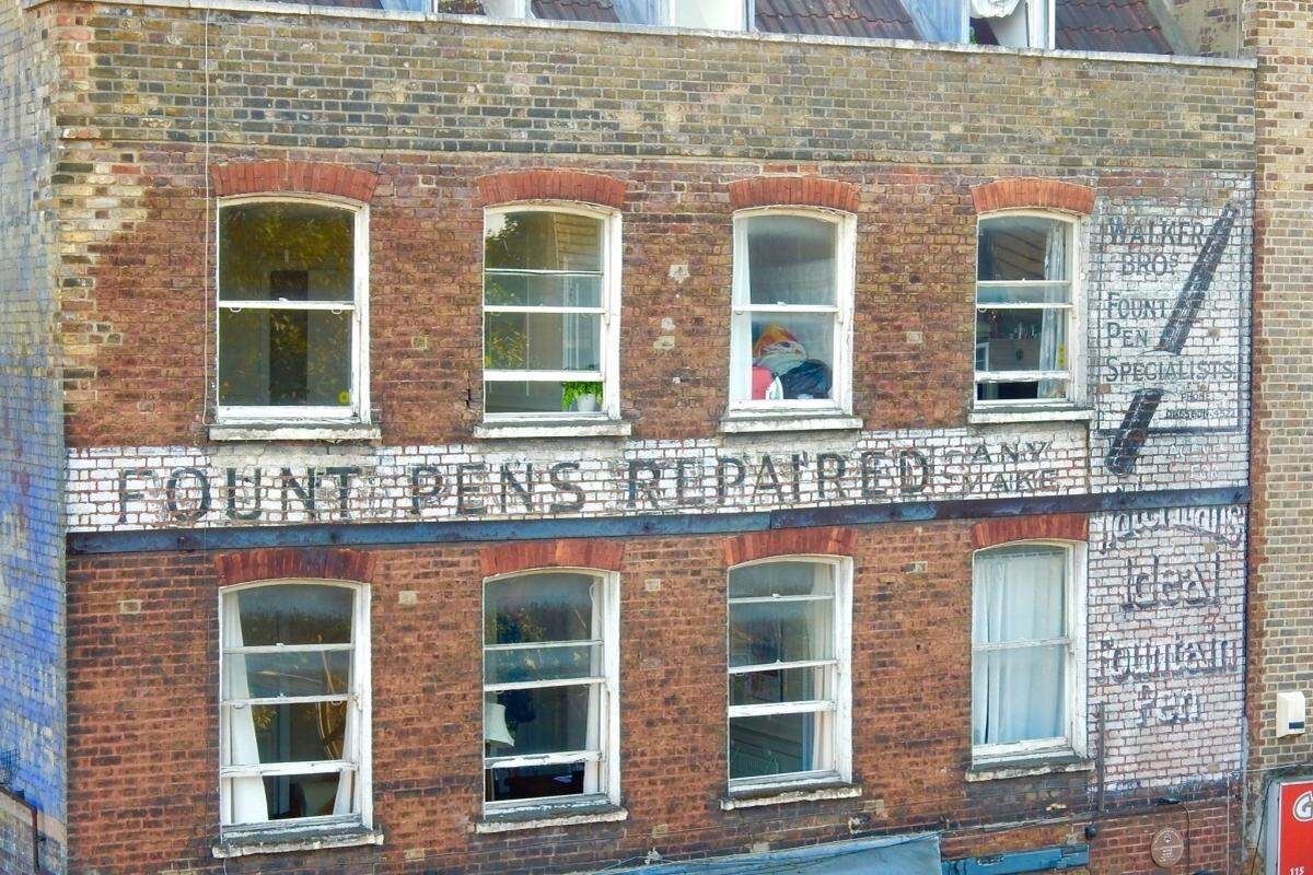 Walker Bros. fountain pen ghost sign on Stoke Newington Church Street in London, England.