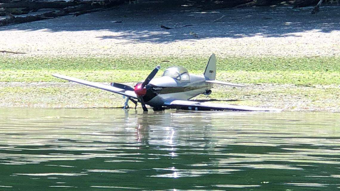 A small plane crash landed on a beach on the northern end of McNeil Island in Pierce County.