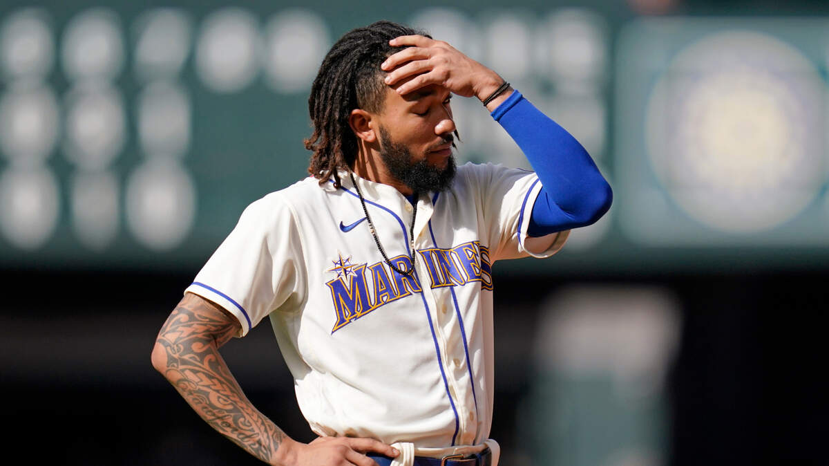 Seattle Mariners’ J.P. Crawford stands on the field after he flew out to end the seventh inning of a baseball game against the Arizona Diamondbacks, Sunday, Sept. 12, 2021, in Seattle. (AP Photo/Elaine Thompson)
