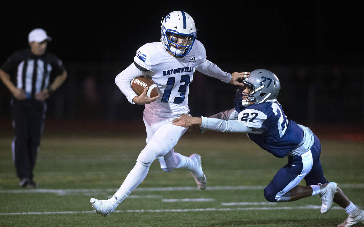 Eatonville wide receiver Zach Smith fights off River Ridge linebacker Kaden Rodriguez during Friday night’s football game at South Sound Stadium in Lacey on Oct. 4, 2019.