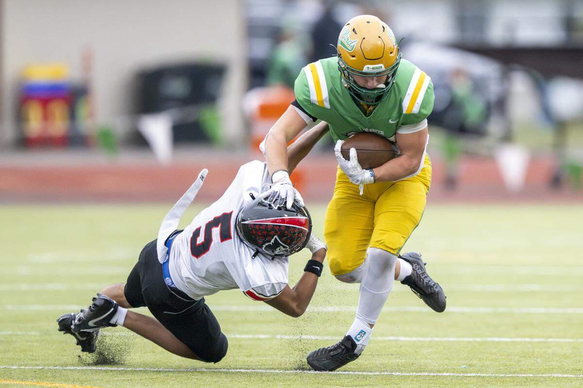Franklin Pierce free safety Jeremiah Orcutt (5) is pushed to the ground while attempting to tackle Tumwater running back Blake Heryford (26) on Saturday, Nov. 22, 2025, in Tumwater.
