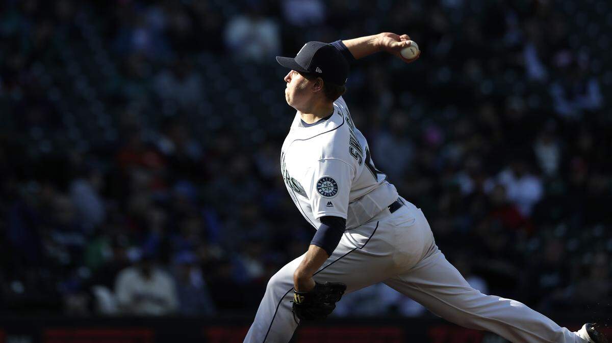 Seattle Mariners starting pitcher Erik Swanson throws against the Cleveland Indians during the fourth inning of a baseball game Wednesday, April 17, 2019, in Seattle. (AP Photo/Elaine Thompson)