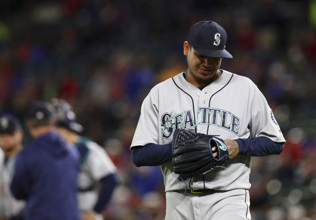 Seattle Mariners starting pitcher Felix Hernandez (34) leaves the game in the sixth inning after hitting Texas Rangers Adrian Beltre with a pitch during a baseball game Friday, April 20, 2018, in Arlington, Texas. (AP Photo/Richard W. Rodriguez)