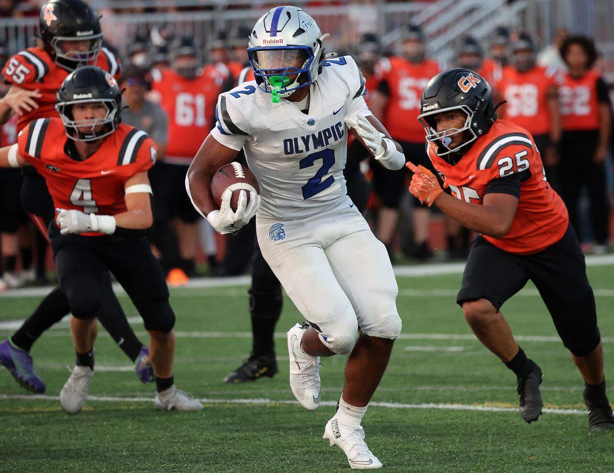 Olympic’s Chace Webster (2) carries the ball down the field during their 40-6 win over Central Kitsap on Friday, Sept. 12, 2025.