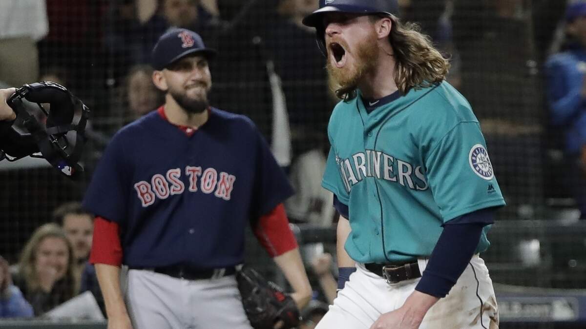 Seattle Mariners' Ben Gamel reacts after he scored a run against the Boston Red Sox during a baseball game, Friday, June 15, 2018, in Seattle. (AP Photo/Ted S. Warren)