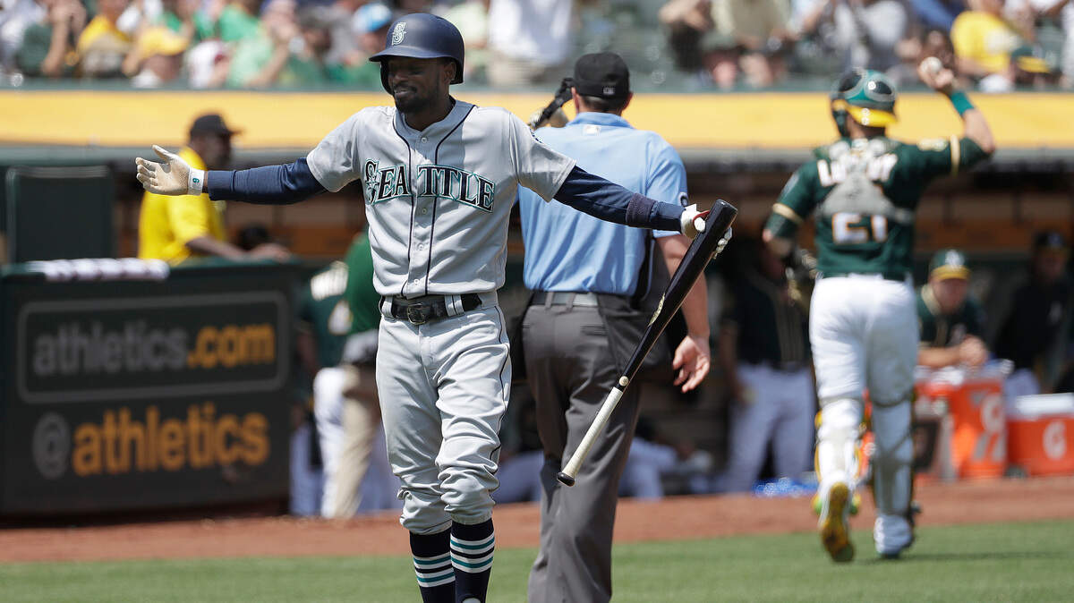 Seattle Mariners’ Dee Gordon reacts after striking out against the Oakland Athletics during the fifth inning of a baseball game in Oakland, Calif., Wednesday, Aug. 15, 2018. (AP Photo/Jeff Chiu)