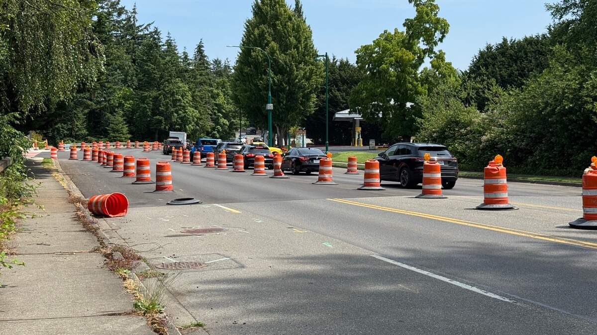Traffic barrels have remained near the intersection of Wollochet Drive and Wagner Way Northwest for months due to delays in a city project to repave the intersection and install a new traffic signal, bike lane and improvements for pedestrians, Monday, June 23, 2025, in Gig Harbor, Wash.