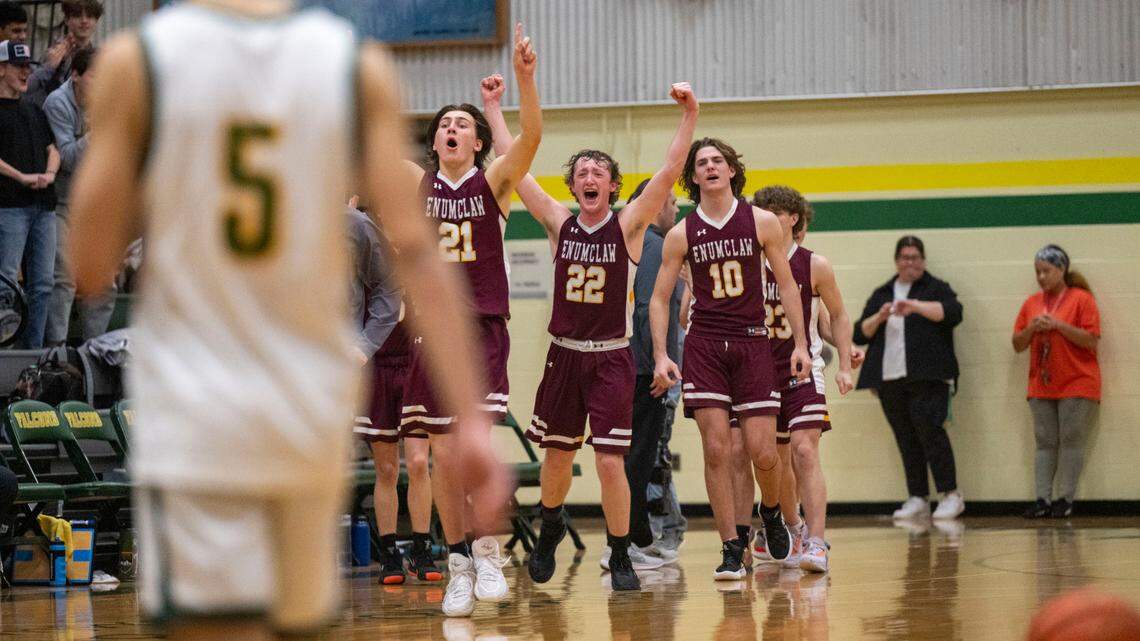 The Enumclaw bench celebrates after the Hornets hung on to beat Foss, 69-64, in 2A SPSL game on Tuesday, Jan. 24, 2023, in Tacoma, Wash.